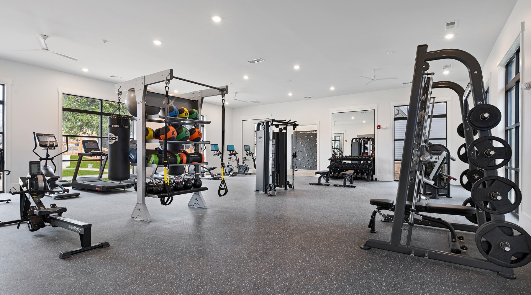 Large fitness center with cardio and weight lifting equipment. Large fitness center with cardio and weight lifting equipment.