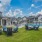 Poolside fire puts with Adirondack chairs on green space