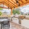 Outdoor kitchen area with grills and seating overlook